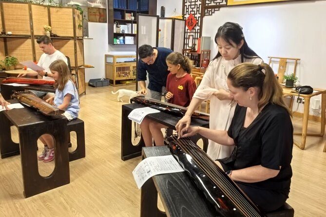 Beijing Culture: Tea Ceremony, Heritage Instrument & Calligraphy - Guqin music: hear it first, then try the strings