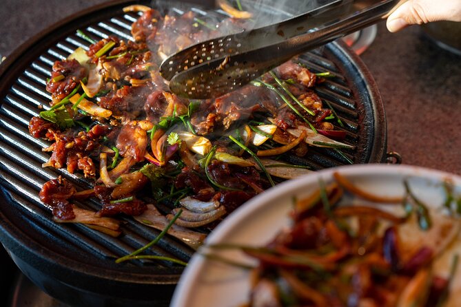 Beijing Hutong Walking Food and Beer Tour at Hidden Restaurants - Stop four: grilled meat, buns, and a final meal