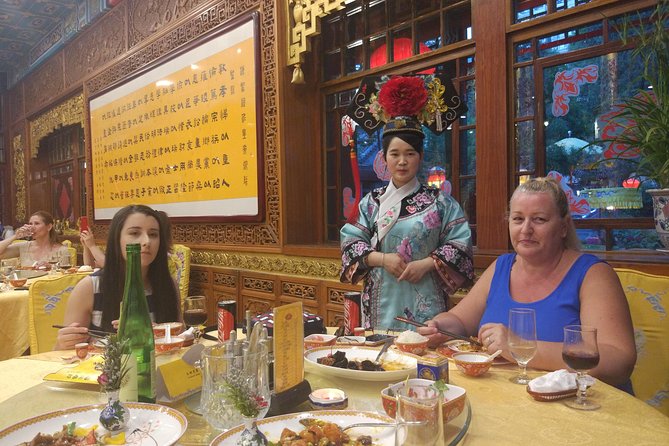 Beijing Imperial Dining Experience at Bai Jia Da Yuan Restaurant with Houhai Lake Bar Tour - Beijing after dark: Bird’s Nest, Water Cube, and old towers
