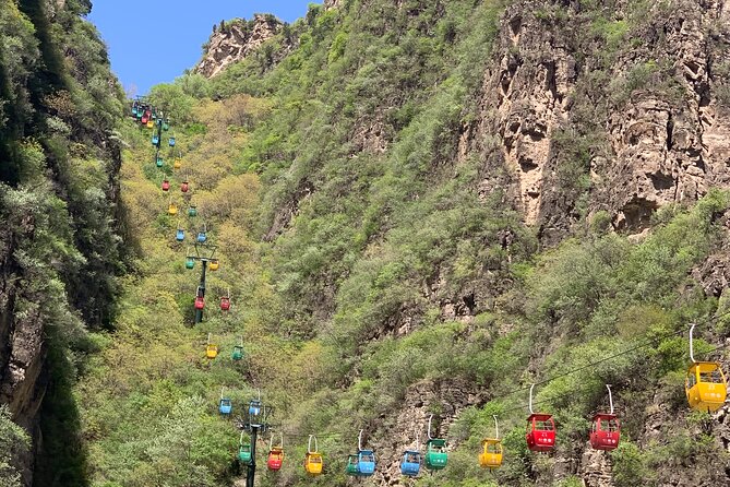 Private Day Tour to Longqing Gorge with Boat Ride and Cable Car from Beijing - The dragon-shaped elevator and Longqing Dam