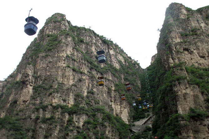 Private Transfer to Longqingxia: For Ravine Tours & Ice Festival - Summer at Longqingxia: elevator, boat, and mountain views